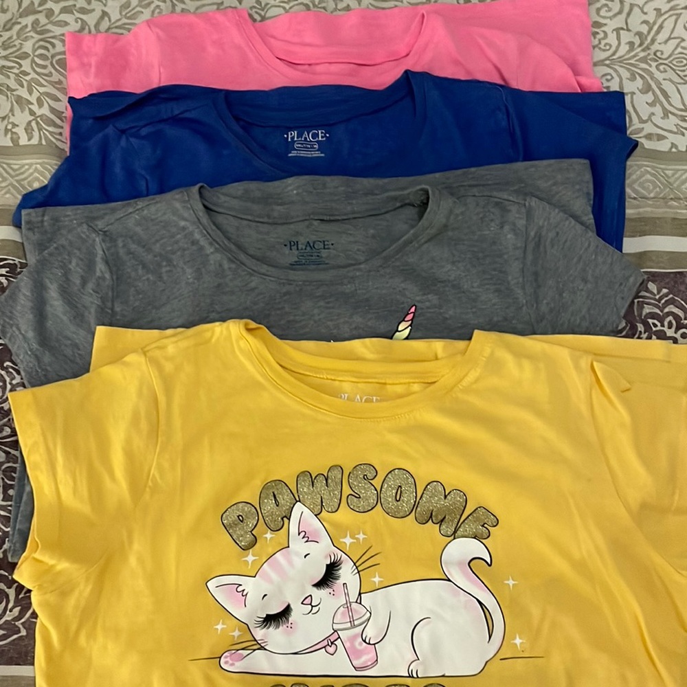 I am selling 4  T-shirts all the same size look all pictures for more details
